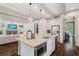 Spacious open concept kitchen with granite counters, stainless appliances and hardwood floors at 175 Centennial Trce, Roswell, GA 30076