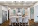 Bright and airy kitchen with a large island, stainless steel appliances, and stylish pendant lighting at 175 Centennial Trce, Roswell, GA 30076