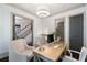 Comfortable home office showcasing a desk, chairs, and an adjacent bathroom and stairway at 175 Centennial Trce, Roswell, GA 30076