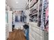 Spacious walk-in closet featuring custom shelving, drawers, and hanging rods for organized storage at 175 Centennial Trce, Roswell, GA 30076