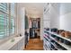 Well-organized walk-in closet with shelving units, shoe racks, and ample storage space at 175 Centennial Trce, Roswell, GA 30076