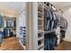 Expansive walk-in closet with custom storage solutions, including shelves and hanging space at 175 Centennial Trce, Roswell, GA 30076