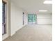 Large finished basement with carpet, bright windows, and sliding doors to backyard at 2528 Chimney Springs Dr, Marietta, GA 30062