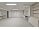 Spacious finished basement with plush carpet, built-in shelves, and desk area with storage at 2528 Chimney Springs Dr, Marietta, GA 30062