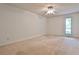 Spacious carpeted bedroom with natural light from a window and neutral wall colors at 2528 Chimney Springs Dr, Marietta, GA 30062