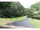 Scenic community walking path surrounded by lush landscaping, trees, and greenery, creating a serene atmosphere at 2528 Chimney Springs Dr, Marietta, GA 30062
