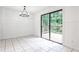 The dining area boasts a deck entrance, white wainscoting, and tile flooring at 2528 Chimney Springs Dr, Marietta, GA 30062