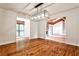 Elegant dining area opens to living space, with hardwood floors and view of stone fireplace at 2528 Chimney Springs Dr, Marietta, GA 30062