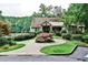 Charming cottage-style house with beautiful landscaping, mature trees and circular driveway, perfect for quiet living at 2528 Chimney Springs Dr, Marietta, GA 30062