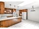 Bright kitchen features custom wood cabinets, white countertops, and a tile floor at 2528 Chimney Springs Dr, Marietta, GA 30062