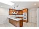 A stylish kitchen features wood cabinets, modern appliances, and an island at 2528 Chimney Springs Dr, Marietta, GA 30062