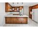 Updated kitchen offers wood cabinets, white countertops, and modern appliances at 2528 Chimney Springs Dr, Marietta, GA 30062