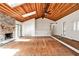 Bright living room offers a wood ceiling, fireplace, and hardwood floors at 2528 Chimney Springs Dr, Marietta, GA 30062