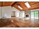 Bright living area boasts hardwood floors, a stone fireplace, and access to outdoor deck at 2528 Chimney Springs Dr, Marietta, GA 30062