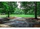 Expansive grassy park area with mature trees, offering a serene and open space for outdoor activities at 2528 Chimney Springs Dr, Marietta, GA 30062
