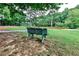 Outdoor park area with green bench seating near the playground and a basketball court at 2528 Chimney Springs Dr, Marietta, GA 30062