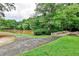 Picturesque walkway near tranquil pond with stone bridge, offering a peaceful setting for leisurely strolls at 2528 Chimney Springs Dr, Marietta, GA 30062