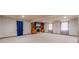 Large basement featuring carpet floors, natural light, and a fireplace with a custom mantle at 2645 Holly Berry Trl, Snellville, GA 30039