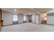 Spacious basement with carpet floors, natural light, and easy access to other rooms at 2645 Holly Berry Trl, Snellville, GA 30039