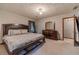 Spacious bedroom featuring a king bed, dresser, and closet for ample storage at 2645 Holly Berry Trl, Snellville, GA 30039