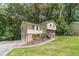 Charming home with a 2 car garage, stone facade and well-manicured lawn at 2645 Holly Berry Trl, Snellville, GA 30039