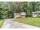 Charming home with a long driveway, stone facade and well-manicured lawn at 2645 Holly Berry Trl, Snellville, GA 30039