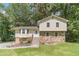 Charming home with stone details, wooden stairs, and a well-maintained lawn at 2645 Holly Berry Trl, Snellville, GA 30039