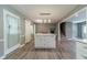 Spacious kitchen area featuring a center island with bar seating and wood-look flooring at 2645 Holly Berry Trl, Snellville, GA 30039