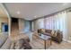 Inviting living room featuring neutral tones, comfortable seating, and natural light at 2645 Holly Berry Trl, Snellville, GA 30039