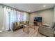 Comfortable living room with stylish decor, including a plush sofa and modern lighting at 2645 Holly Berry Trl, Snellville, GA 30039