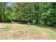 Expansive backyard with mature trees and natural surroundings, offering privacy at 3013 Michael Sw Dr, Marietta, GA 30060
