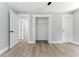Bedroom with an open closet and multiple doors that provide access to other rooms in the home at 3013 Michael Sw Dr, Marietta, GA 30060
