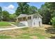 Attractive home featuring white brick, a garage, and a neatly kept lawn at 3013 Michael Sw Dr, Marietta, GA 30060