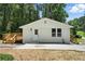 Charming single-story home with a fresh white brick exterior and newly built wooden deck at 3013 Michael Sw Dr, Marietta, GA 30060