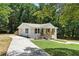 Beautifully renovated home showcasing a fresh exterior with stylish front porch and landscaping at 3013 Michael Sw Dr, Marietta, GA 30060
