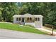 Charming white brick home with a welcoming front porch and well-manicured lawn at 3013 Michael Sw Dr, Marietta, GA 30060
