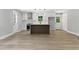 Spacious kitchen with island, white cabinets, modern appliances, and bright, natural light at 3013 Michael Sw Dr, Marietta, GA 30060