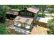 Aerial view of a home's backyard and sunroom extension in a wooded setting at 3597 Embry Cir, Atlanta, GA 30341