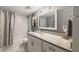 Bathroom with granite countertops, white vanity, tile flooring, and tiled shower/tub combination at 3597 Embry Cir, Atlanta, GA 30341