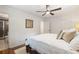 A comfy bedroom showcases a king-size bed, modern ceiling fan, and an ensuite bath at 3597 Embry Cir, Atlanta, GA 30341
