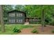 Traditional two-story brick home with a well-manicured front yard and inviting curb appeal, showcasing its classic design at 3597 Embry Cir, Atlanta, GA 30341
