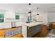 The kitchen features stainless appliances, granite countertops, a central island, and wood floors at 3597 Embry Cir, Atlanta, GA 30341