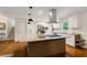 Bright kitchen features stainless appliances, granite countertops, a large island, and hardwood floors at 3597 Embry Cir, Atlanta, GA 30341