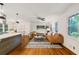 Open concept living room and kitchen with hardwood floors and plenty of natural light at 3597 Embry Cir, Atlanta, GA 30341