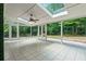 Bright sunroom with skylights and expansive windows showcasing backyard at 3597 Embry Cir, Atlanta, GA 30341