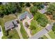 Aerial view showcasing the home's layout, driveway, mature trees, and proximity to nearby streets and homes at 4016 Dover Ave, Alpharetta, GA 30009
