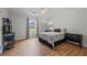 Bright bedroom with hardwood floors and neutral decor at 4016 Dover Ave, Alpharetta, GA 30009
