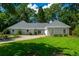 Charming one-story home with a well-manicured lawn, circular driveway, and lush landscaping at 4016 Dover Ave, Alpharetta, GA 30009