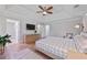 Spacious main bedroom features tray ceiling, fan, walk-in closet and en-suite bathroom at 4016 Dover Ave, Alpharetta, GA 30009