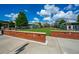 Town green space with manicured lawn, brick borders, and nearby restaurants, a community focal point at 4016 Dover Ave, Alpharetta, GA 30009